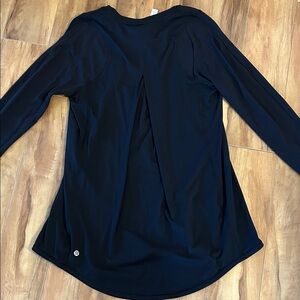 lululemon athletica black tuck and flow top.